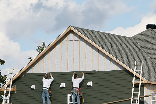 Professional Storm Damage Siding Repair technician working in Youngsville, NC